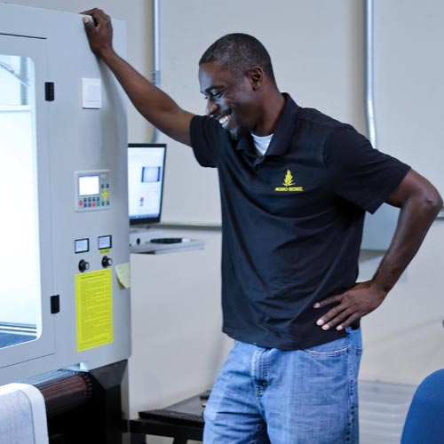Contract Manager Darius Overseeing a Machine at the Factory