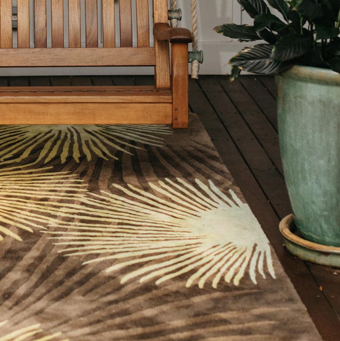 Beautiful Colorful Dark Brown, Tan, and Orange Area Rug With a Hawaiian Design Print