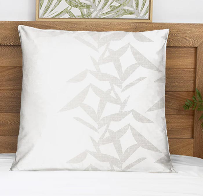 Beautiful White and Silver Contract Hawaiian Design Product Euro Sham Placed On a White Bed