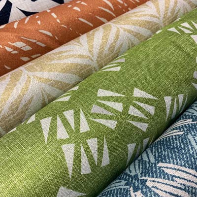 Colorful Orange, Tan, Green, and Blue Fabrics From NOHO HOME CONTRACT Products 